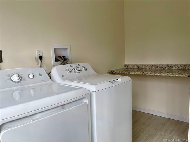 Laundry room has a large alcove with shelf | Image 12