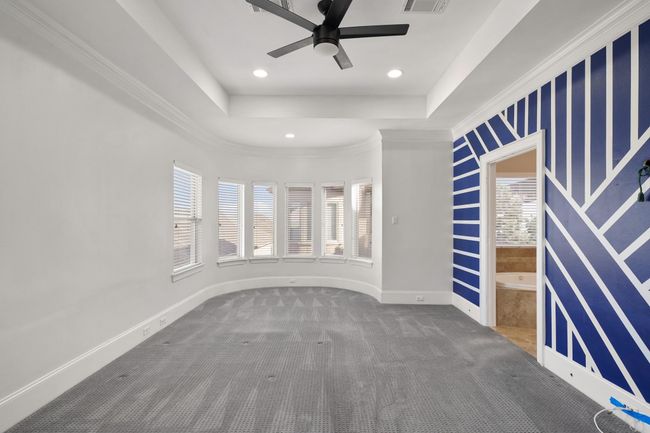 Primary suite with bay window sitting area. | Image 13