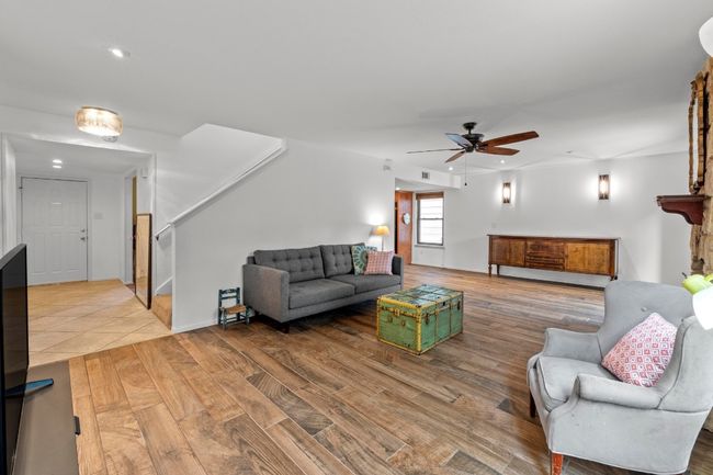 Wood-look tile flows seamlessly underfoot, blending durability with laid-back style and tying together the main living spaces with a clean, modern finish | Image 4