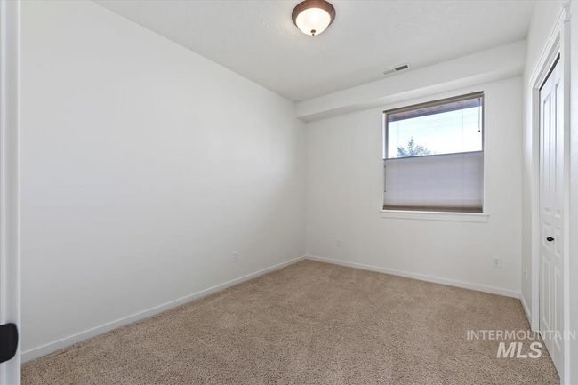 Unfurnished bedroom featuring carpet floors and a closet | Image 39
