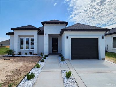 View of front facade with a garage | Image 1