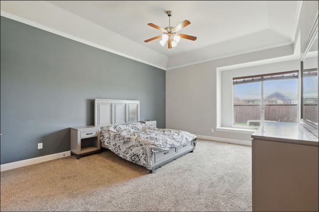 Laundry area with washing machine and dryer and baseboards | Image 21