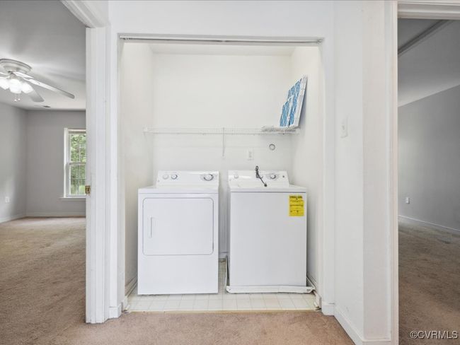 Washroom with carpet, separate washer and dryer, and ceiling fan | Image 24