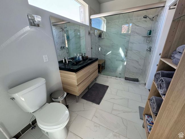 Full bath in rental featuring marble finish floor, toilet, vanity, and a marble finish shower | Image 37