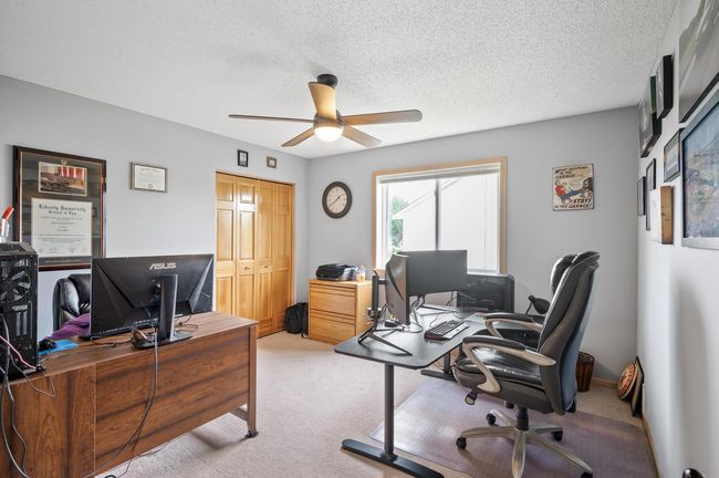 5th bedroom on the upper level currently utilized as a home office. | Image 27