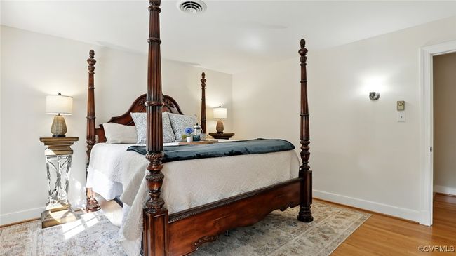 Bedroom with wood finished floors and baseboards | Image 25