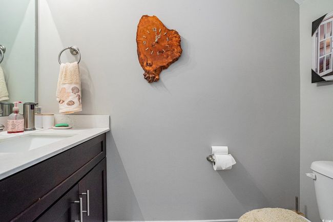 Half bathroom with vanity and toilet | Image 11