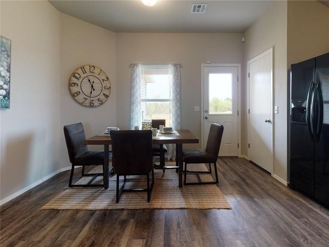 Dining room featuring dark hardwood / wood-style flooring | Image 10