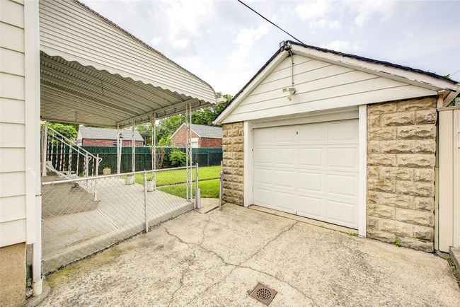 Detached garage featuring concrete driveway | Image 48