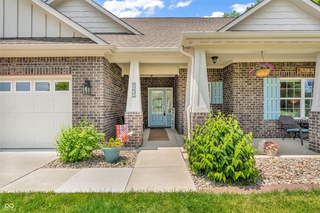 welcoming front porch - great space to sit and admire the view of the lake | Image 4