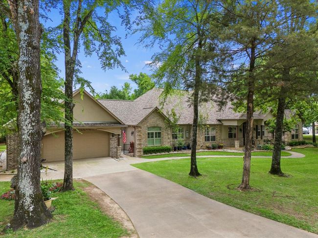 View of front of house featuring a garage and a front lawn | Image 6