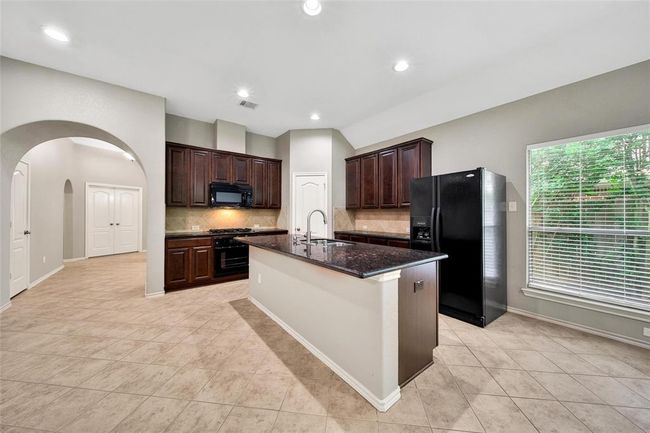Another view of the beautiful granite kitchen. There's plenty of work space and storage. | Image 11