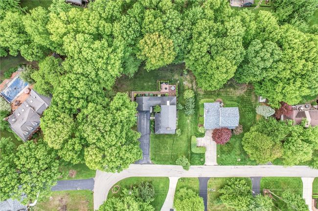 Discover the serene setting of this property from above. | Image 48