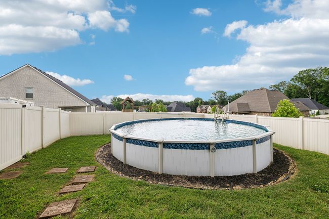 Relax in this refreshing above around pool that has been edged and mulched! Pool conveys with Robot cleaner and accessories. 1107 Sycamore Leaf Way Murfreesboro, TN 37129 | Image 35