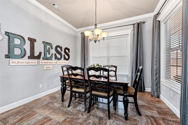 dining room with lots of natural light, windows open to backyard | Image 10