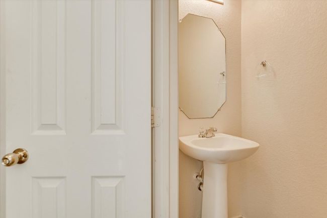 Half bathroom located downstairs | Image 16