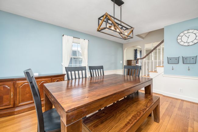 Stairs off dining room lead to second floor | Image 19