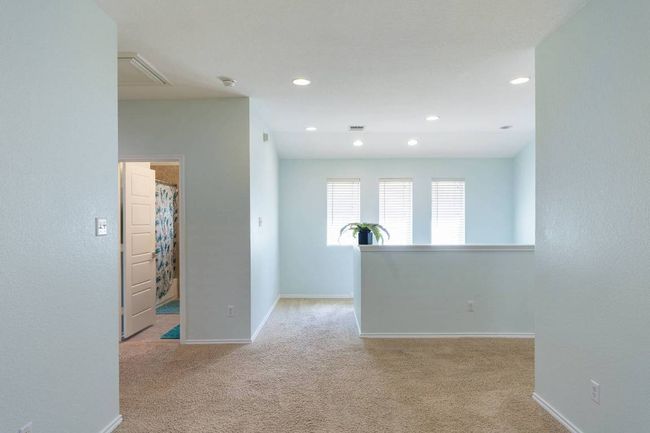 Spare room featuring carpet floors, recessed lighting, and a smoke detector | Image 27