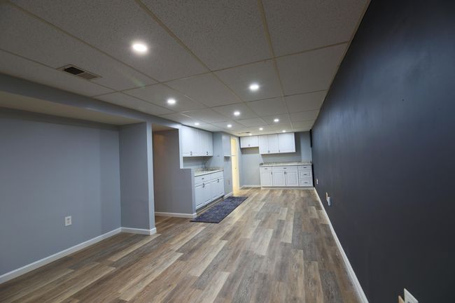 Another view of this spacious family room or media room. | Image 19