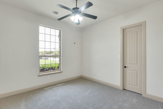 Carpeted spare room featuring baseboards and ceiling fan | Image 24