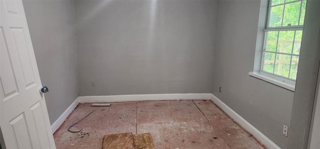 Spare room featuring baseboards | Image 12