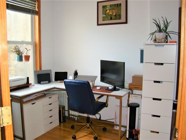 Office with light hardwood / wood-style flooring | Image 18