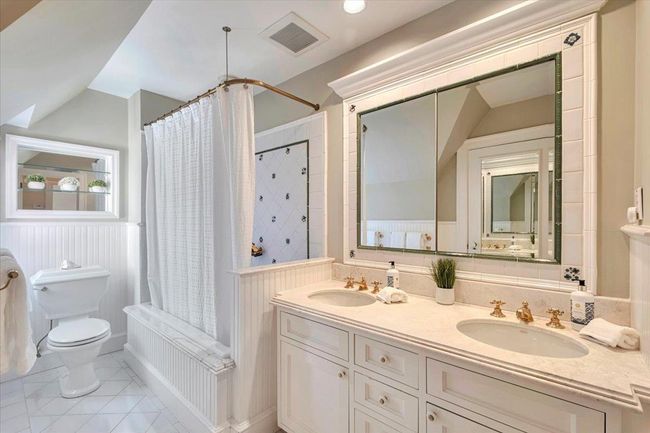 Ensuite bathroom offers custom cabinetry, high end finishes, shower / bath combo, just perfect! | Image 16