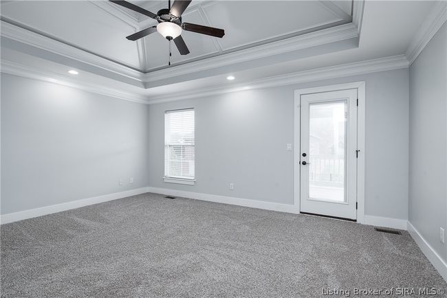 Owner's suite has beautiful vaulted trey ceiling with recessed lighting, ceiling fan, and lots of natural light! | Image 15