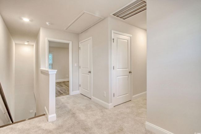 Hallway featuring light colored carpet | Image 21