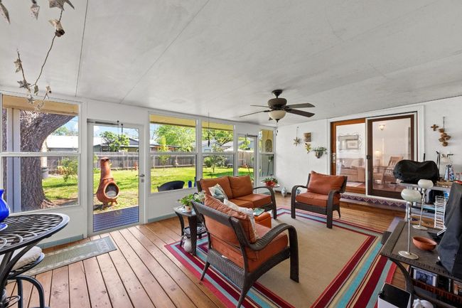 Sunroom with outdoor lounge area and ceiling fan | Image 22