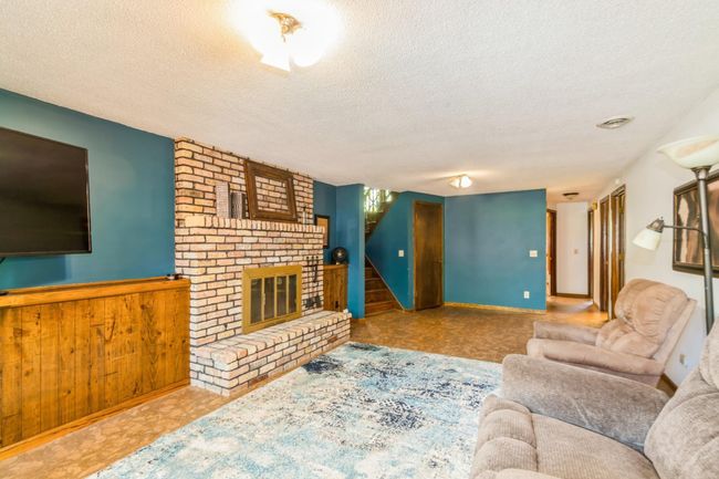 Down the hall you will find 2 bedrooms, the laundry/utility room and a full bathroom. | Image 41