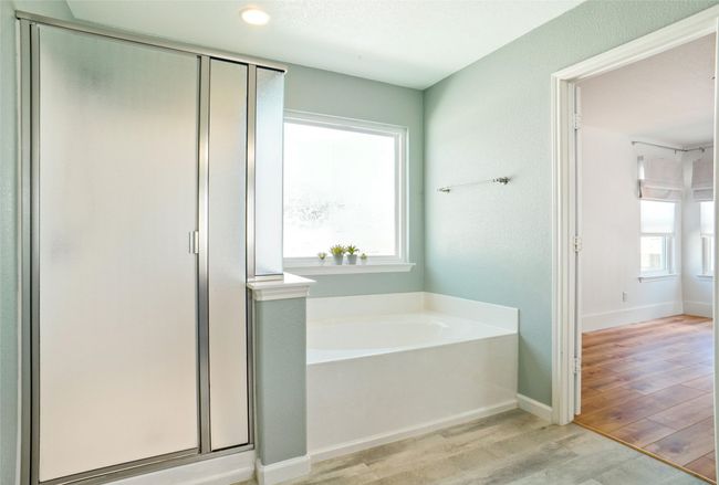 Bedroom #2 featuring light hardwood / wood-style floors and ceiling fan | Image 17