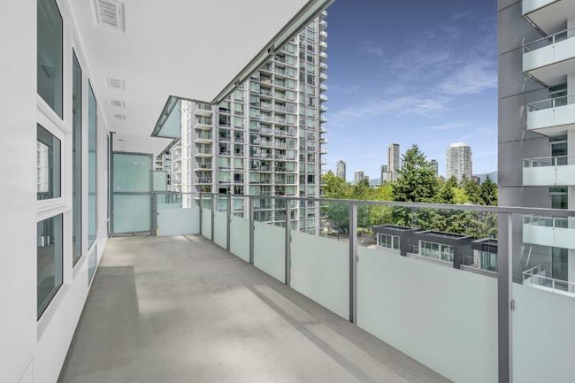Balcony featuring a city view | Image 16