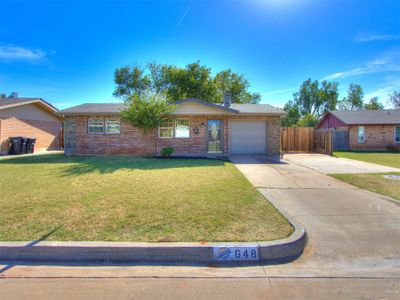 Single story home with a front yard and a garage | Image 2