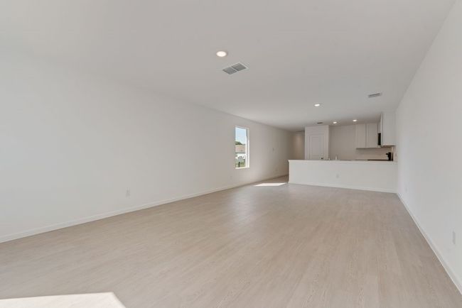 Unfurnished living room featuring recessed lighting and light wood finished floors | Image 8