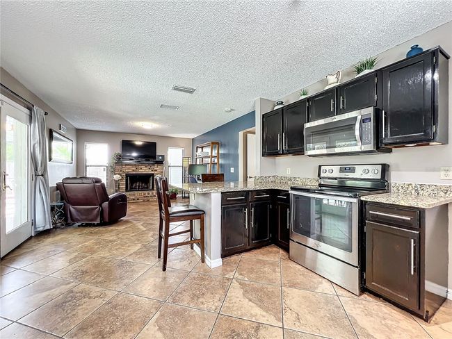 View to family room | Image 16