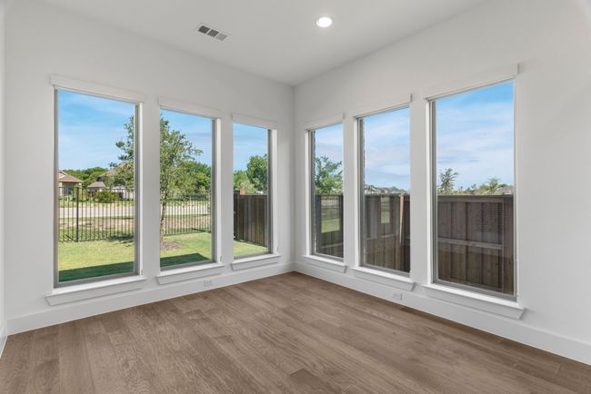 Unfurnished sunroom with wood finished floors, recessed lighting, and baseboards | Image 29