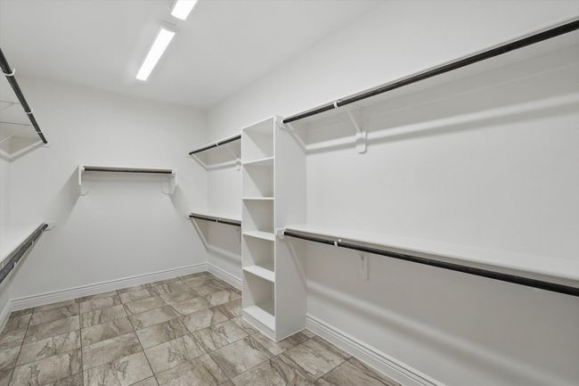 Spacious walk-in closet in Primary Bedroom Suite | Image 17