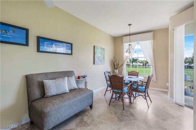 Breakfast nook and seating area have fabulous views of the 5th fairway and green. | Image 14