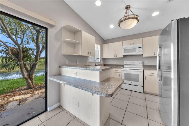 0 - 9780 W Daffodil Ln, Home with 3 bedrooms, 2 bathrooms and null parking in Miramar FL | Image 4