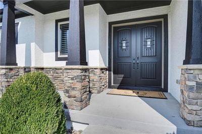 Porch with stone accents. | Image 2