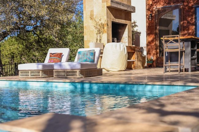 Community pool featuring a patio area | Image 34