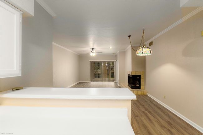 View over the breakfast bar to the living/dining beyond. | Image 7