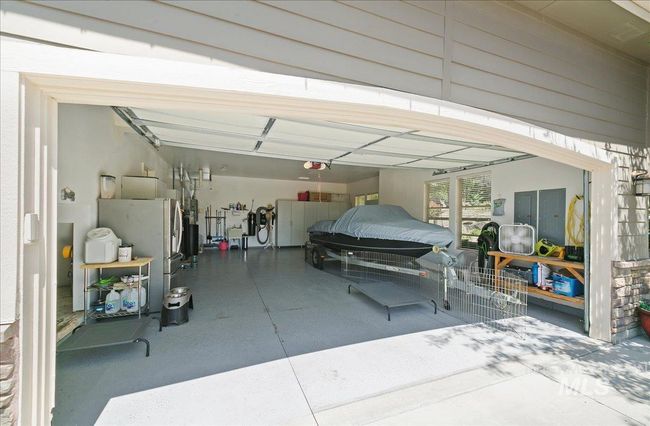 Garage with a garage door opener | Image 36