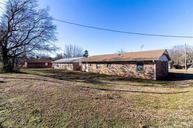 Back of house featuring brick siding and a lawn | Image 7
