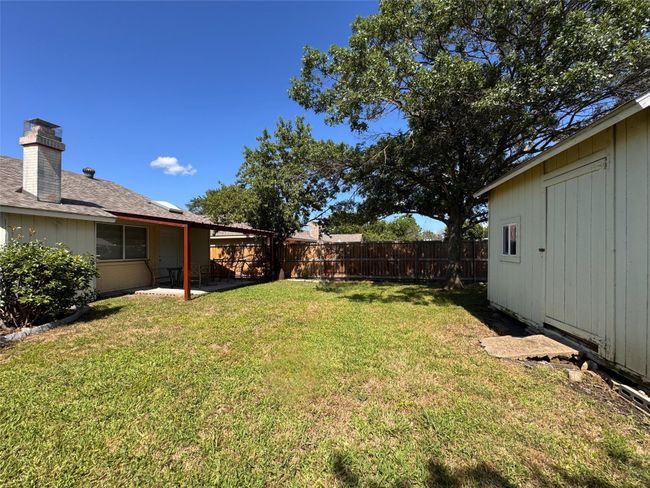 View of fenced backyard | Image 18