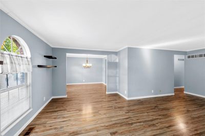 Open floor plan with newer flooring & fresh paint | Image 3