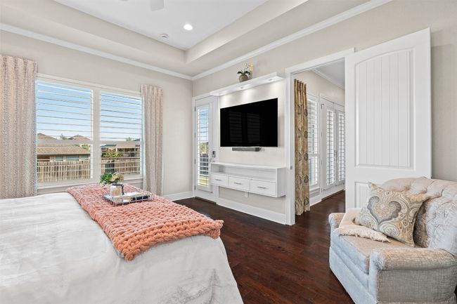 Thoughtful design elements elevate this space with room for a sitting area and plenty of natural light. | Image 17