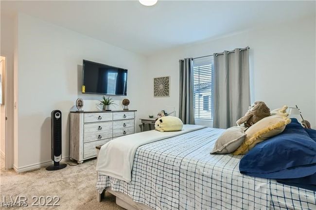 Bedroom with light colored carpet and baseboards | Image 8