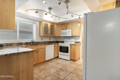 Kitchen, with newer cabinets and granite slab countertops | Image 2